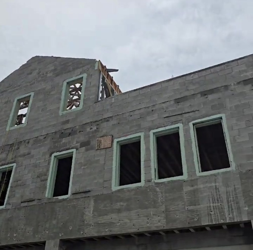 Reinforced concrete masonry walls under construction at Carillon Beach, before stucco